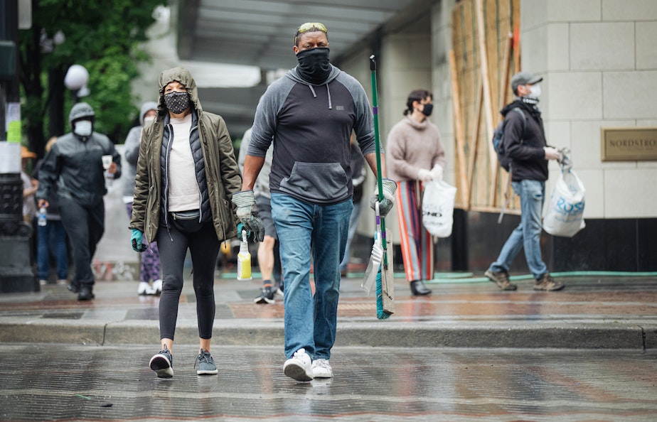 caption: Seattle photographer Joshua Trujillo went downtown on Sunday morning to capture scenes of people cleaning up after the protests on Saturday night. 