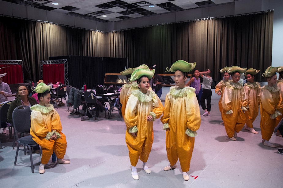 caption: Dance students dressed as pumpkins wait in the kids dressing room before performing during Cinderella on Saturday, February 1, 2020, at McCaw Hall in Seattle. 