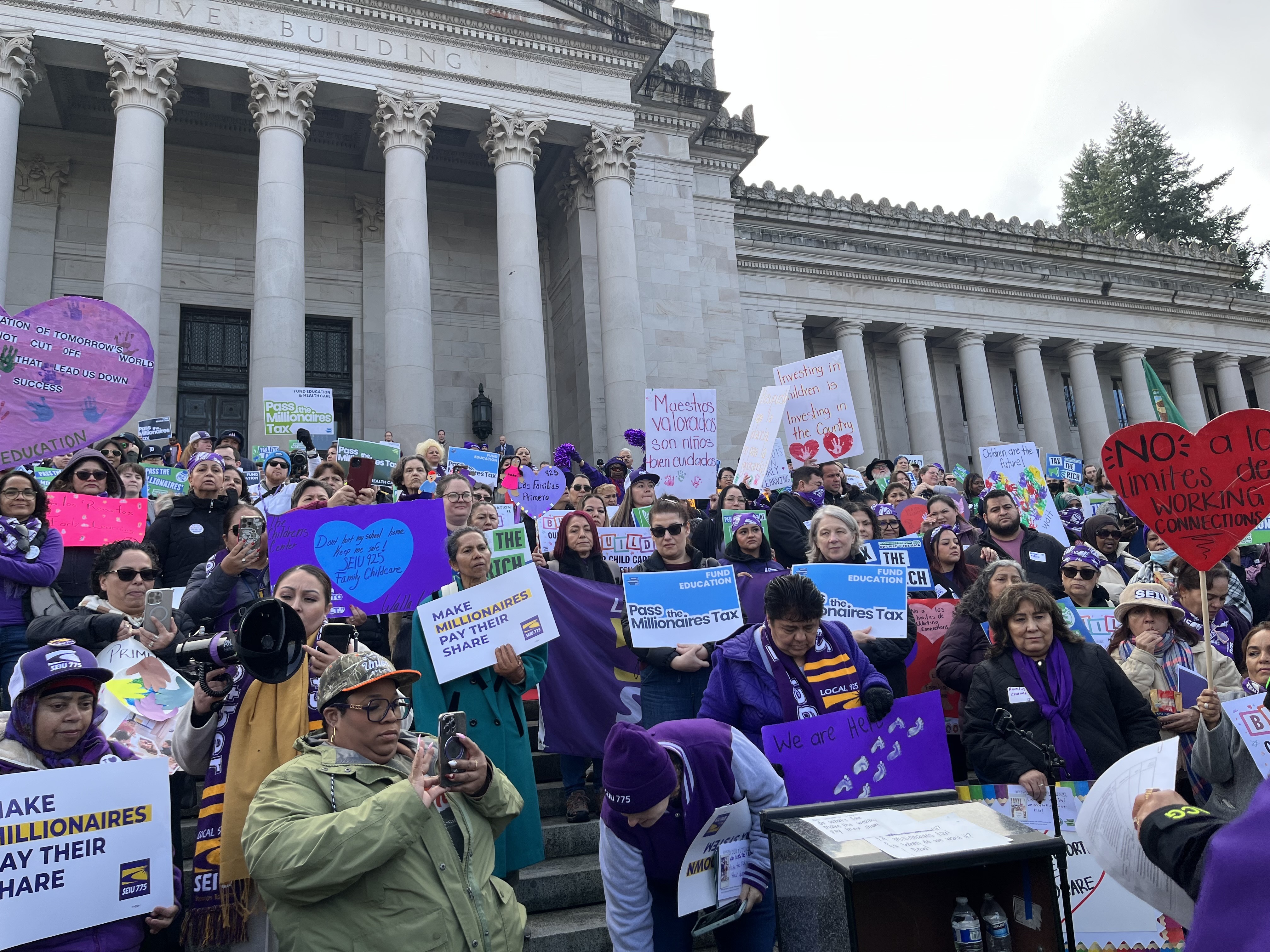 caption: Supporters rally for what they call a "millionaire's tax" — an income tax on people making more than $1 million a year — on Feb. 10, 2026, in Olympia, Wash.