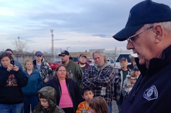 caption:  Duane VanBeek tells Plymouth residents that the evacuation zone had been reduced to one mile. An explosion at an LNG storage tank forced them from their homes Monday morning. Many returned home after spending the day at the Umatilla County Fairgrounds.