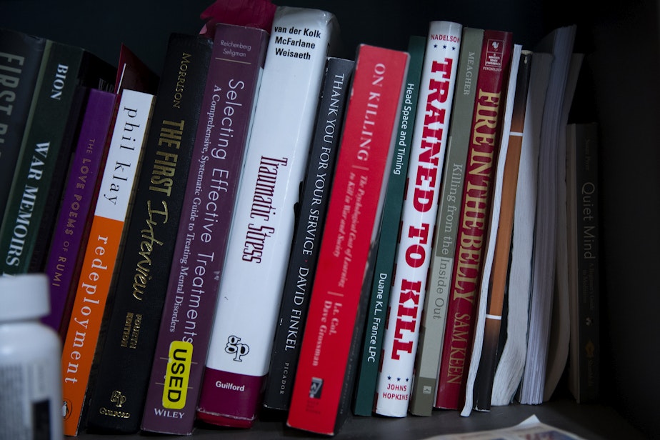 caption: Books belonging to Robert Bates, a veteran and counselor who works primarily with other veterans, are shown on Wednesday, July 9, 2025, at his home office in Quincy.