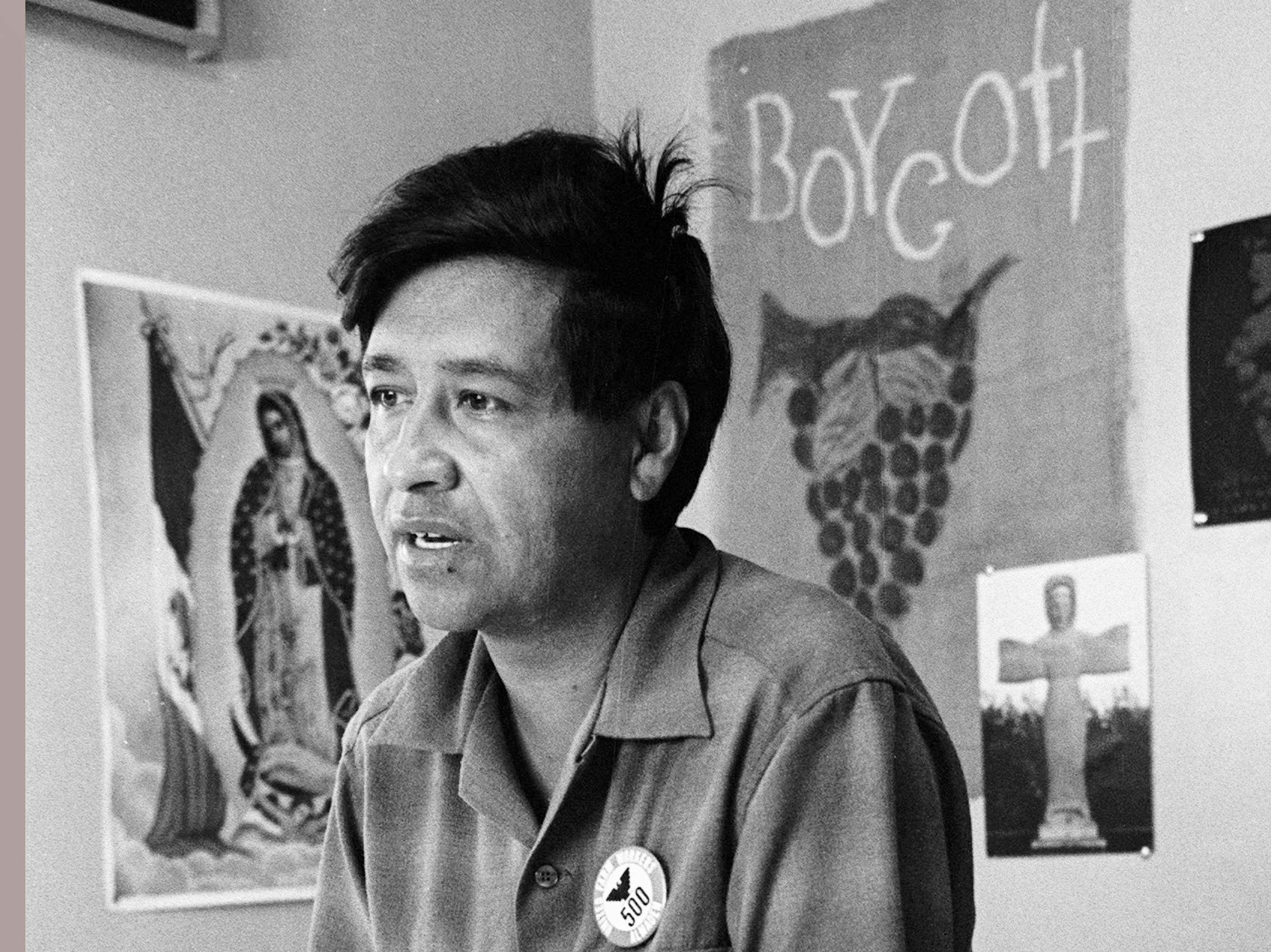 caption: Cesar Chavez, a farm worker, labor organizer and leader of the California grape strike, is seen in a California works office in 1965.