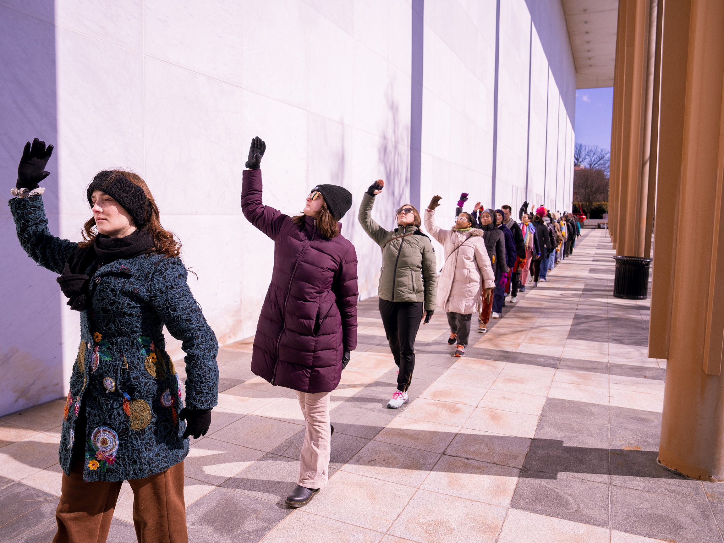 caption: Performers dance outside of the Kennedy Center in Washington, D.C., on Monday. The dance was part of a protest against new leadership by President Trump.