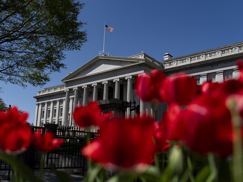 caption: The U.S. Treasury ran a surplus in April, as tax payments jumped by 22% from a year ago. The federal government is still on track to run a deficit of more than $1.5 trillion this year.