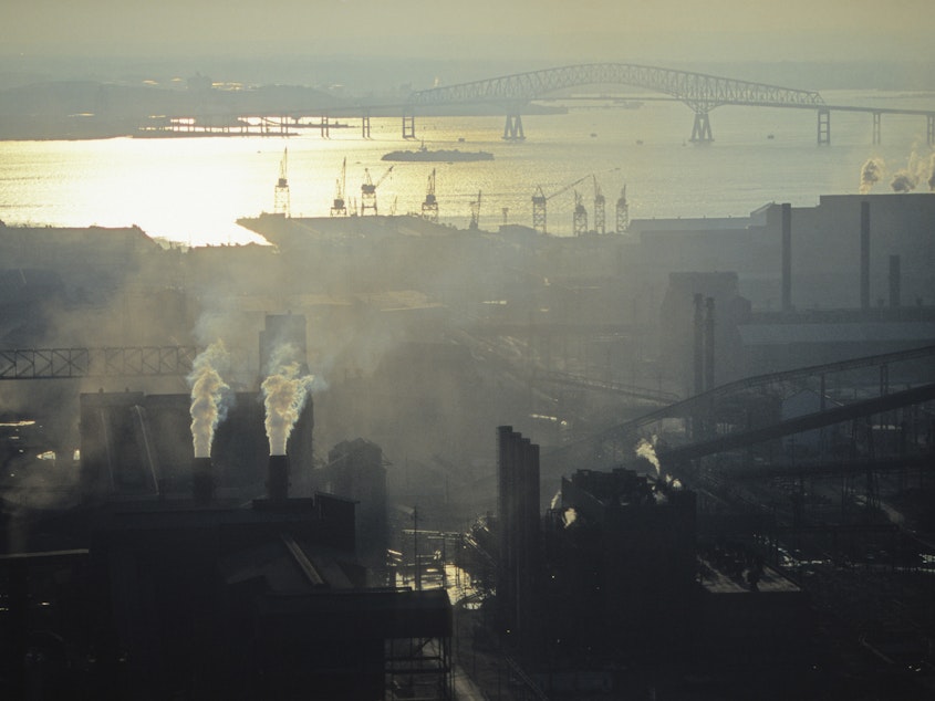 caption: Air pollution from industry and cars continues to create smog in towns and cities around America. Exposure to higher than average levels of smog and other pollutants is linked to chronic lung disease.