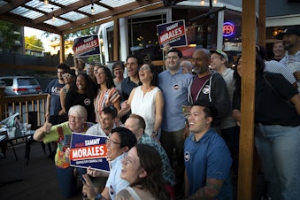 caption: Friends and supporters of Seattle City Council incumbent Tammy Morales, representing District 2, pose for a group photograph during a primary election night gathering on Tuesday, August 1, 2023, at Taco City Taqueria along Rainier Avenue South in Seattle. 