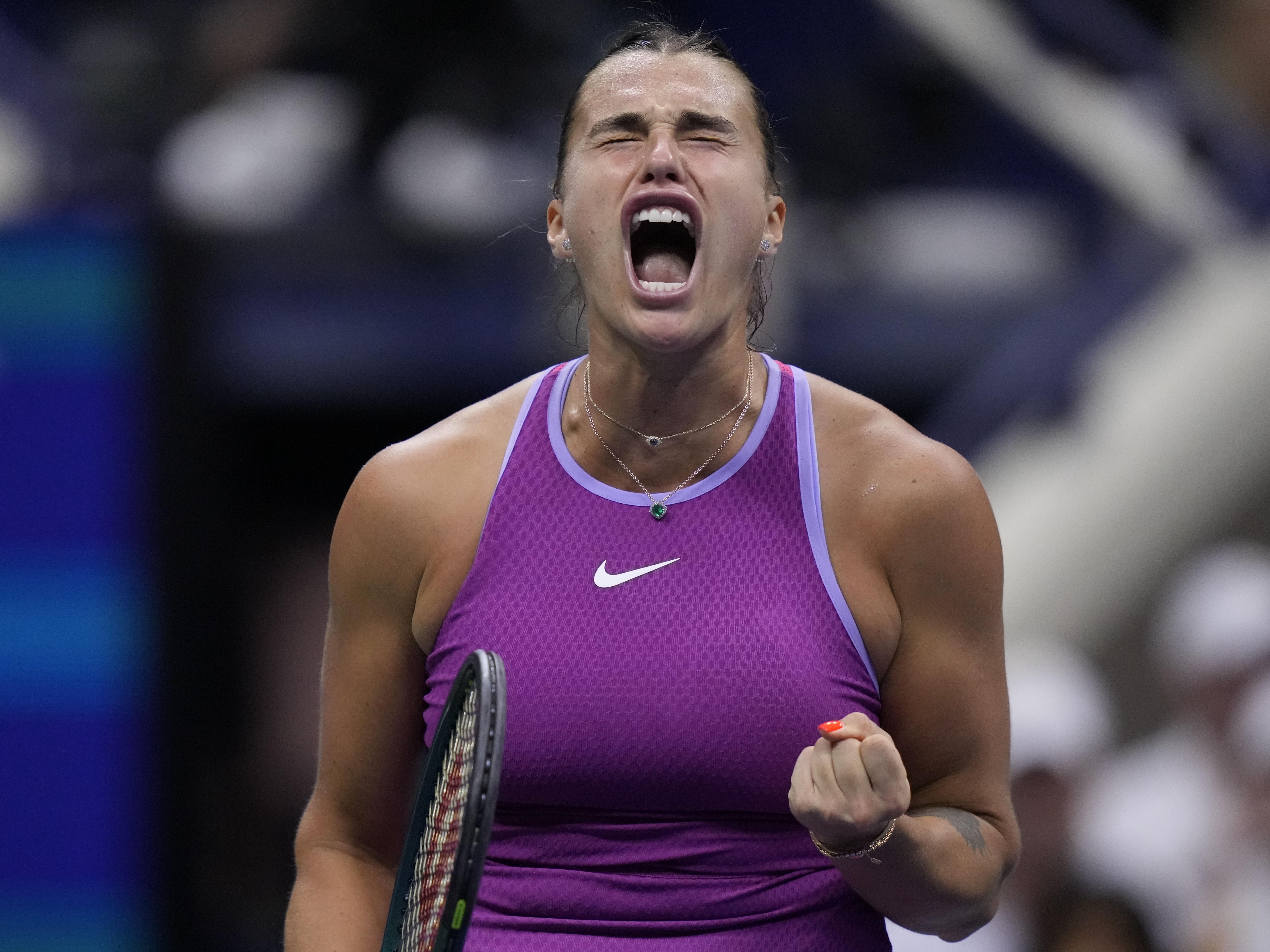 caption: Aryna Sabalenka, of Belarus, reacts against Jessica Pegula, of the United States, during the women's singles final of the U.S. Open tennis championships on Saturday in New York.