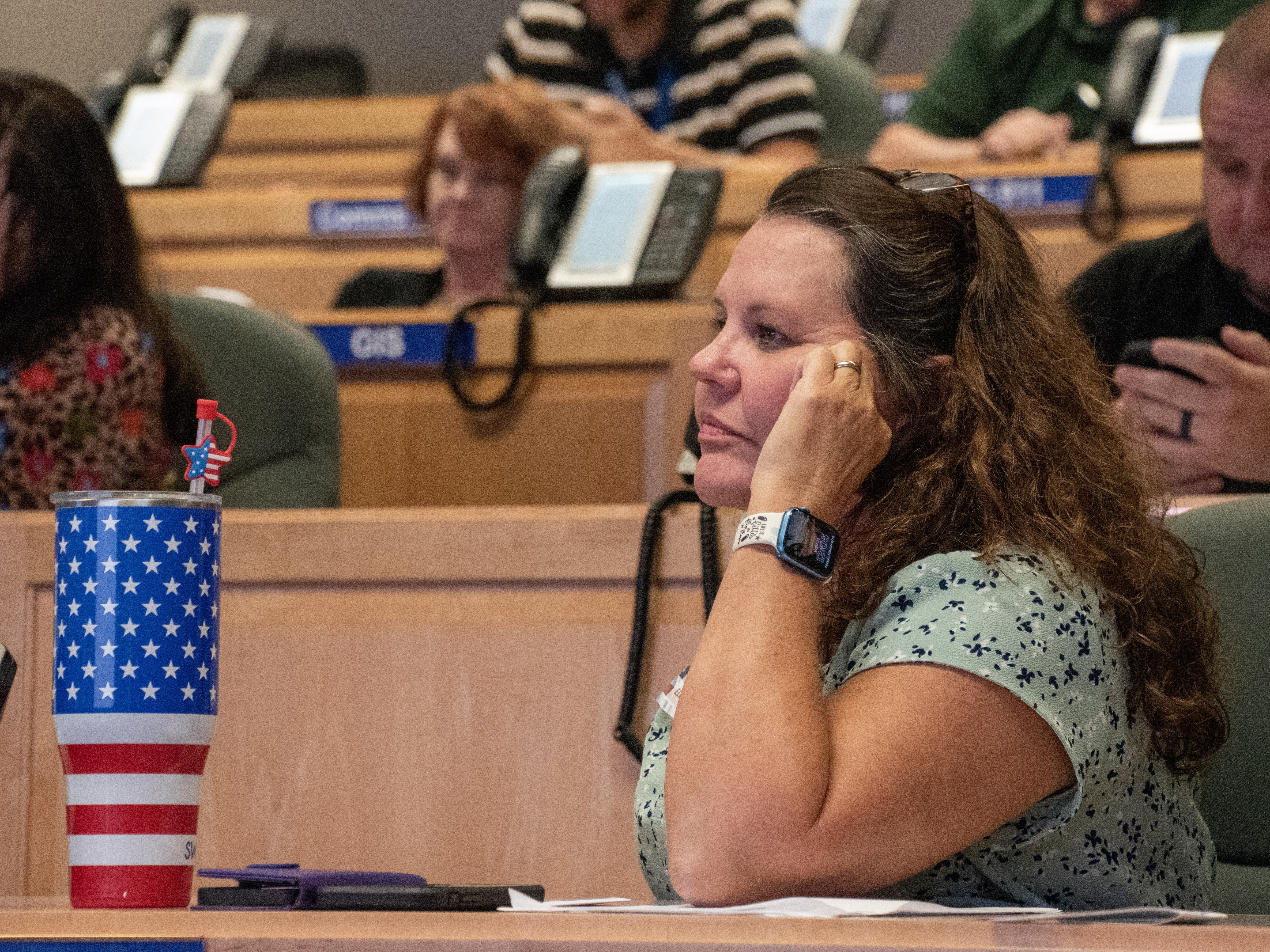 caption: A poll manager listens to a presentation by the Committee for Safe and Secure Elections (CSSE) and the Georgia Secretary of State’s Office in the coastal Georgia town of Brunswick.