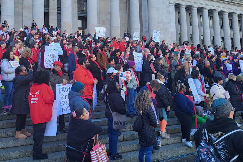 caption: Supporters of rent stabilization legislation in Olympia rallied on the capitol steps Jan. 30, 2024, to pressure Washington lawmakers to keep moving forward with proposals that would cap annual rent increases by landlords. 