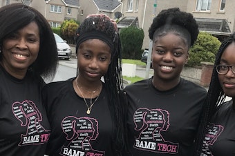 caption: Wait until you see their victory dance (check out the tweet at the end of this post). Evelyn Nomayo (left) was the mentor for the team that created the award-winning Memory Haven app: (left to right) Rachael Akano, Margarent Akano and Joy Njekwe.