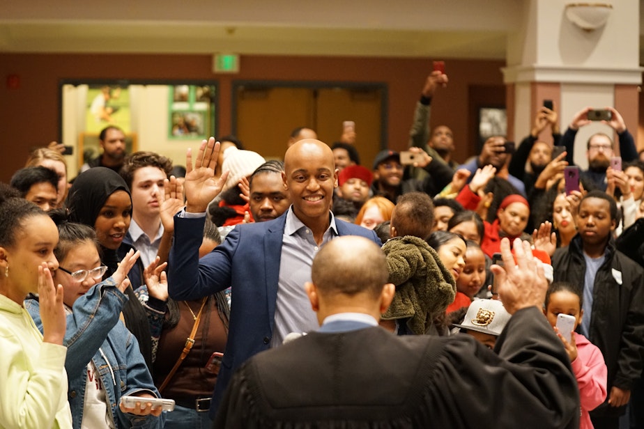 caption: King County Council’s newest member, Girmay Zahilay, is sworn in by Judge Richard Jones, the brother of Quincy Jones. Zahilay invited all the youth in attendance to join him in taking his oath of office on December 22, 2019. 