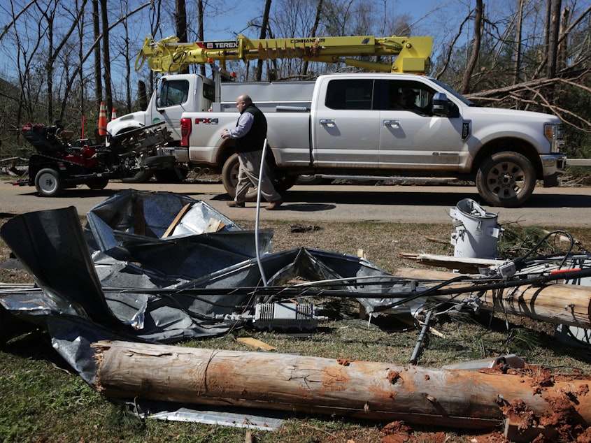 caption: Mayor Bubba Copeland visits an area that was damaged by a tornado on March 5, 2019 in Smiths Station, Ala.