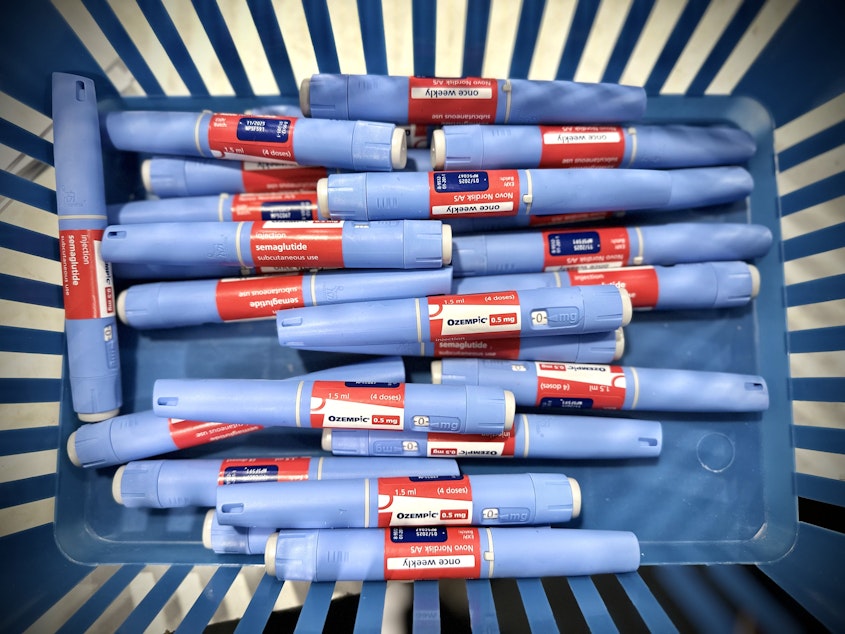 caption: Several Ozempic pens in a basket