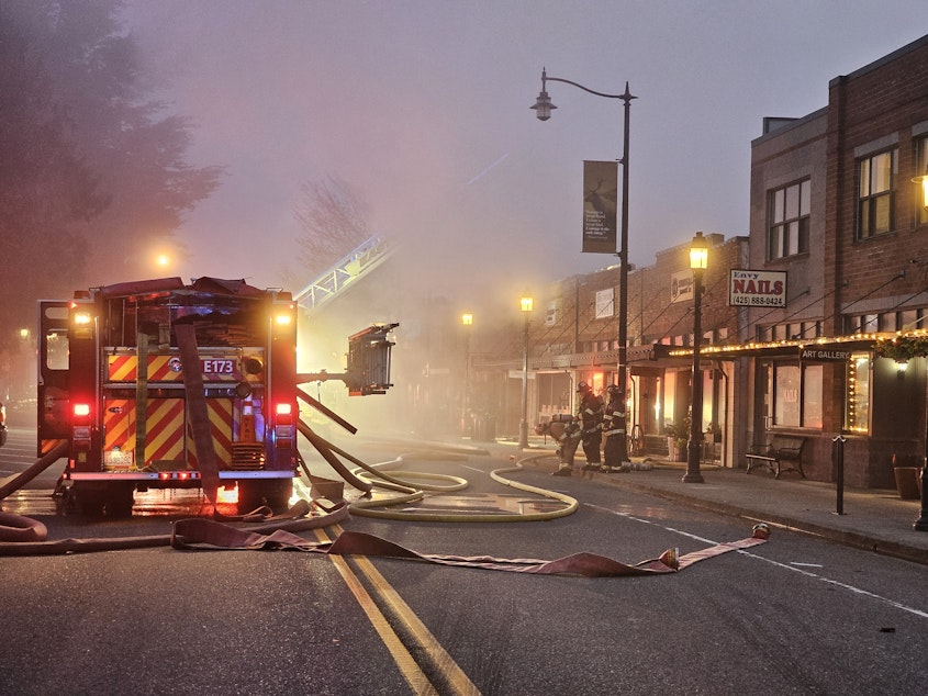 caption: Early morning photo of 2024 large fire of building in Historic Snoqualmie Downtown