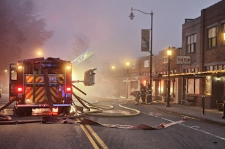 caption: Early morning photo of 2024 large fire of building in Historic Snoqualmie Downtown