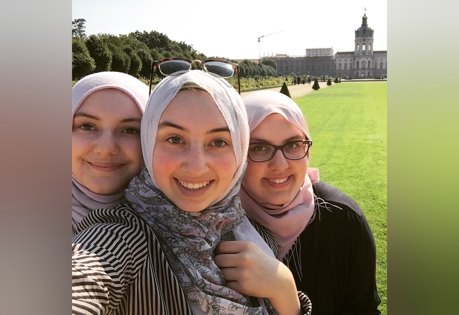 caption: Aliya, Batoul and Amina Al-Sadi. Aliya Al-Sadi, a student at the University of Washington, spoke with her older sister Amina, a KUOW producer, about how she processed the San Bernardino shootings.