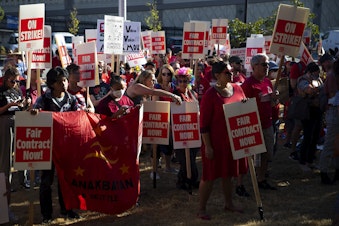 caption: Seattle Public Schools teachers rally ahead of the first day of school on Tuesday, September 6, 2022, outside of Seattle Public School's offices along 3rd Avenue South in Seattle.