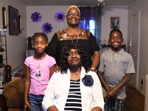 caption: Gloria "Gigi" Johnson is the caregiver for her mother and two grandchildren. Johnson is a pillar of the Warner Robins community and promotes voting in her neighborhood.