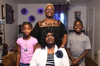 caption: Gloria "Gigi" Johnson is the caregiver for her mother and two grandchildren. Johnson is a pillar of the Warner Robins community and promotes voting in her neighborhood.