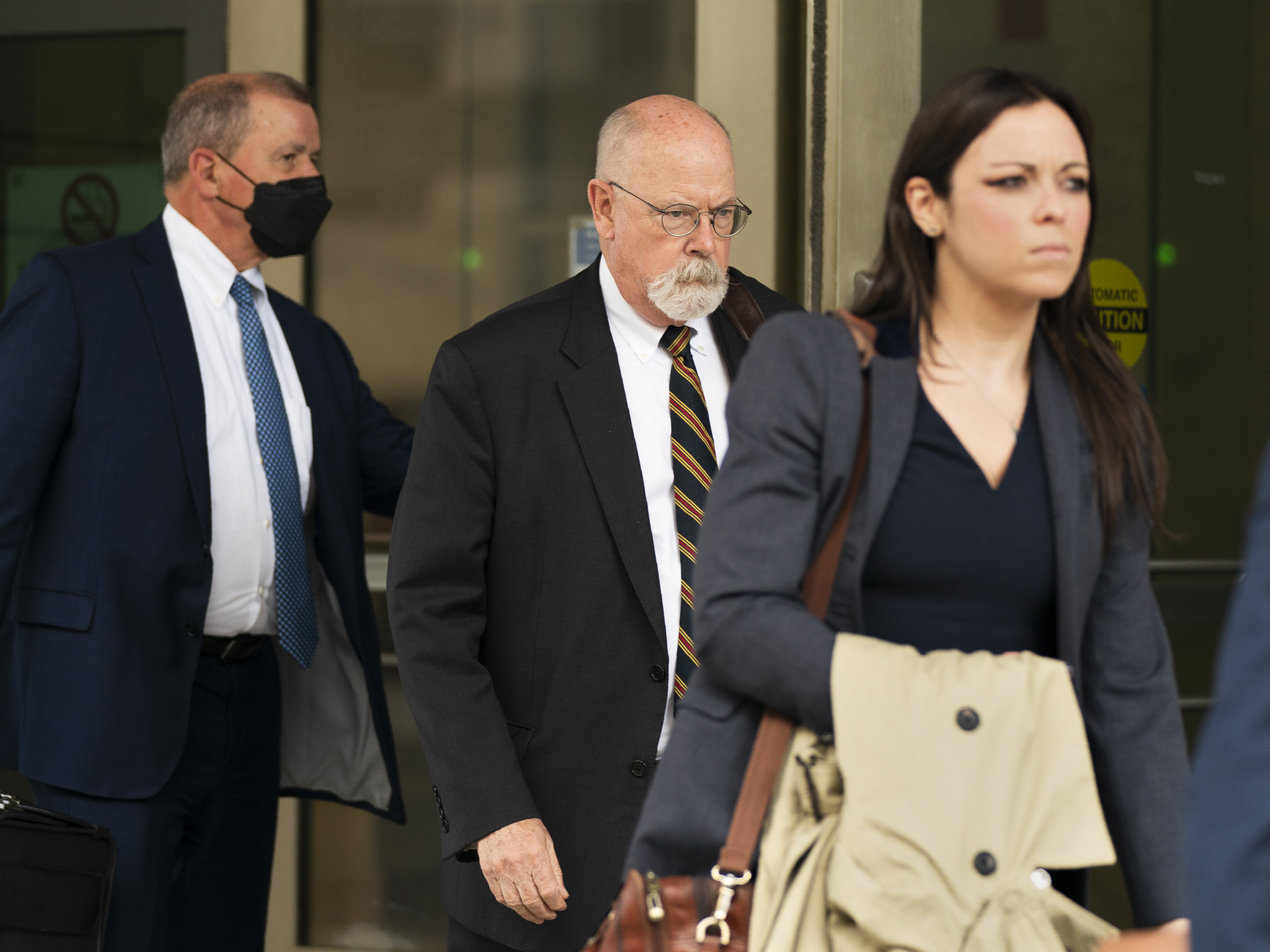 caption: Special counsel John Durham, center, the prosecutor appointed to investigate potential government wrongdoing in the early days of the Trump-Russia probe, leaves federal courthouse in Washington, Monday, May 16, 2022.