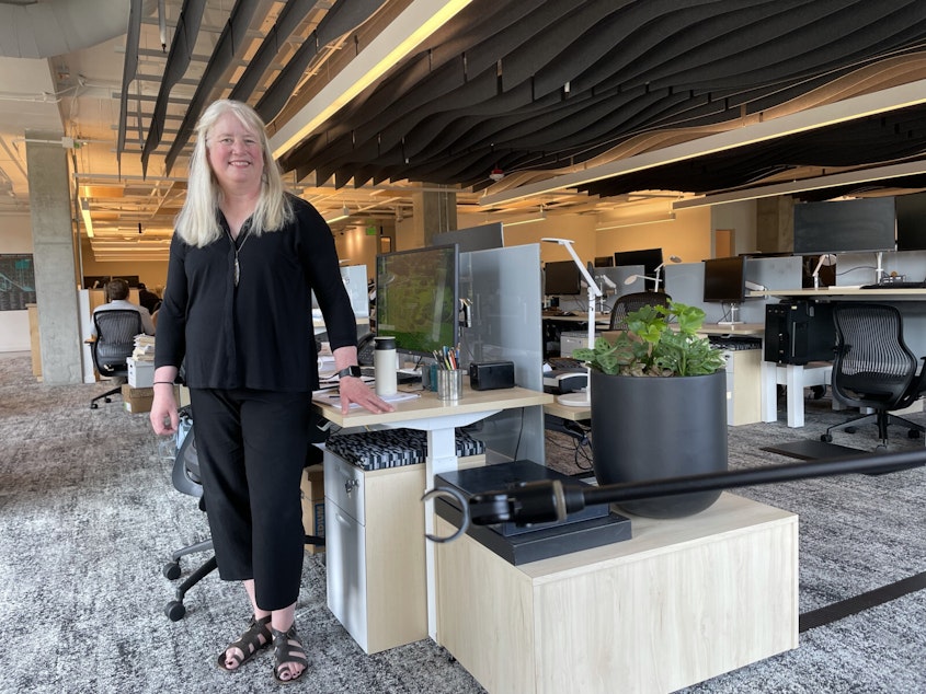 caption: Kristen Scott in the new Watershed offices.