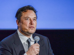 caption: Owner Elon Musk has told remaining Twitter employees that they must decide whether to stay or go by Thursday afternoon. Here, Musk, as CEO of Tesla, speaks at a conference in Norway.