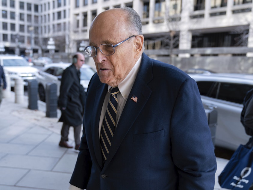 caption: Rudy Giuliani arrives at the federal courthouse in Washington, D.C., on Wednesday for a trial to determine how much he will have to pay two 2020 Georgia election workers who he falsely accused of fraud.
