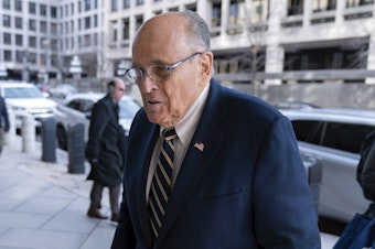 caption: Rudy Giuliani arrives at the federal courthouse in Washington, D.C., on Wednesday for a trial to determine how much he will have to pay two 2020 Georgia election workers who he falsely accused of fraud.