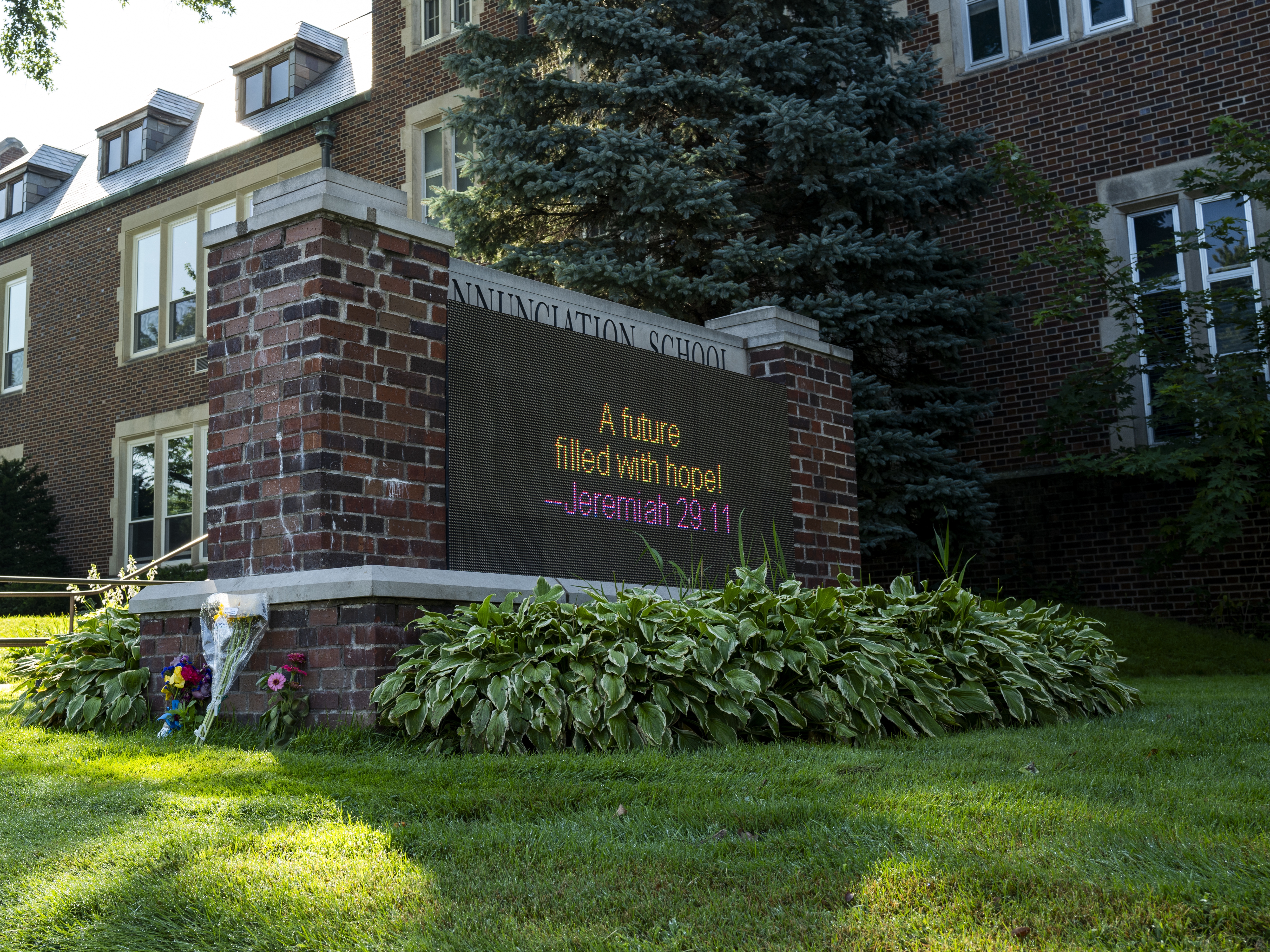 caption: Officials have commended the actions of older children and adults during a mass shooting at the Annuncation Church in Minneapolis.