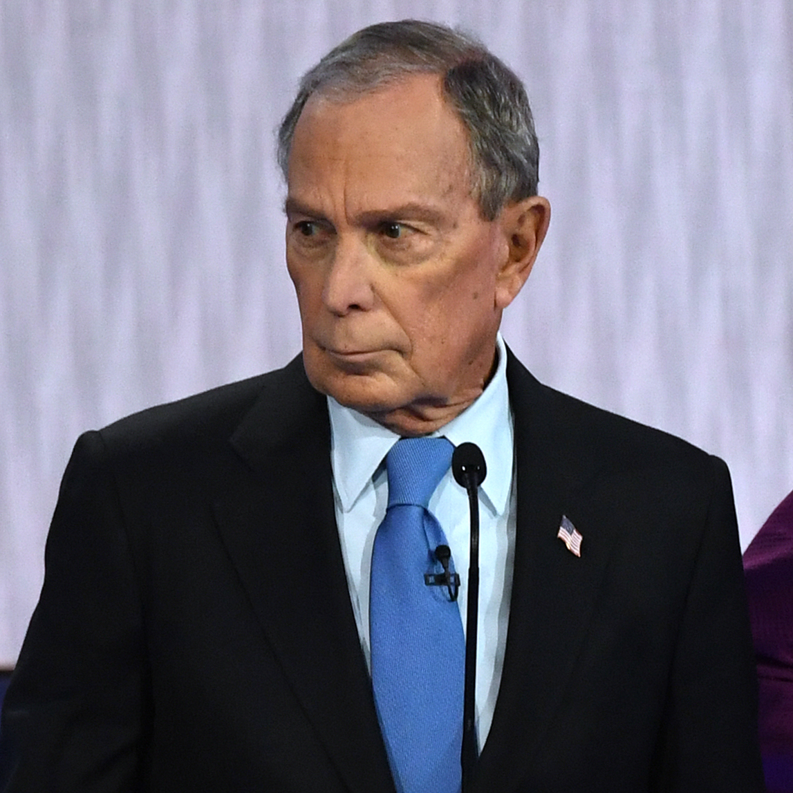 caption: Democratic presidential hopeful and former New York Mayor Mike Bloomberg looks on during a Democratic primary debate Wednesday in Las Vegas, Nevada.