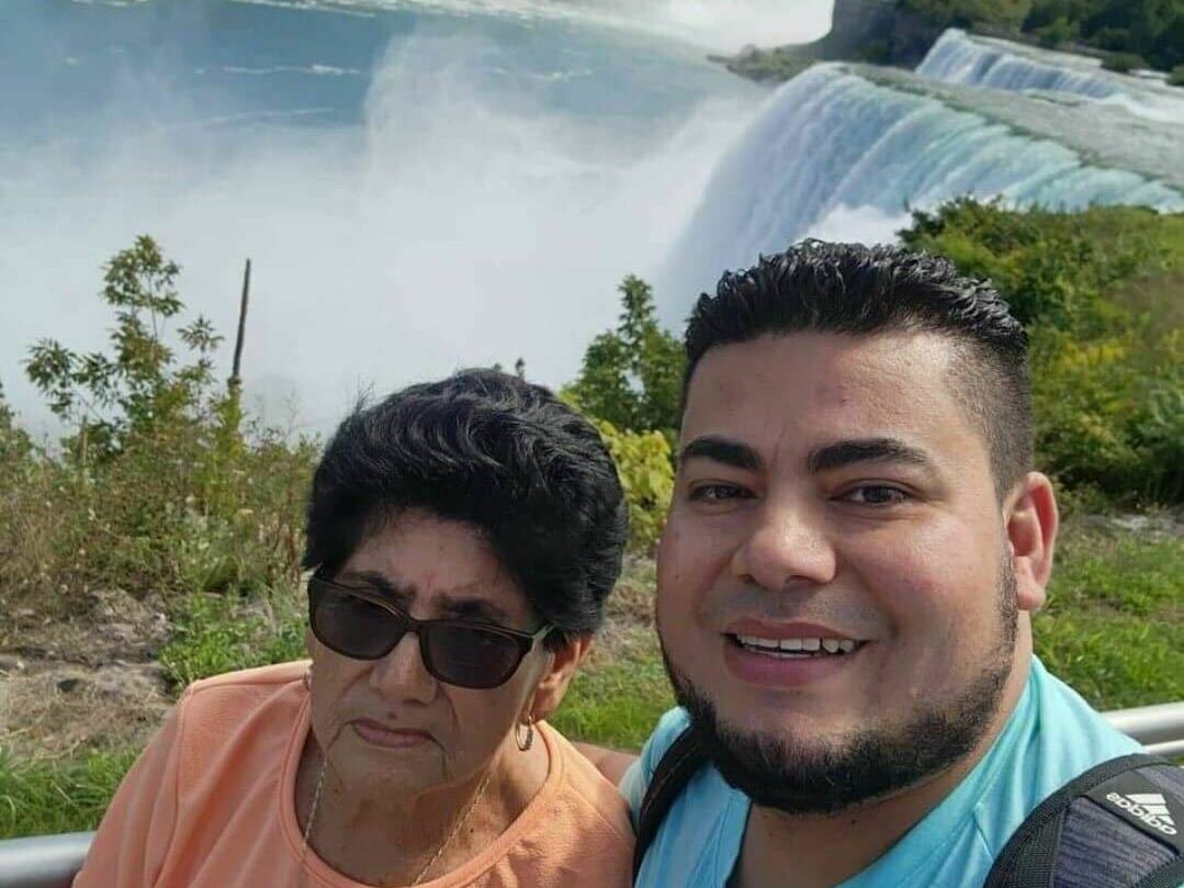 caption: Maynor Suazo Sandoval (right) and his mother visiting the Niagara Falls, in New York state.