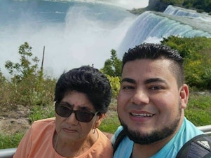 caption: Maynor Suazo Sandoval (right) and his mother visiting the Niagara Falls, in New York state.