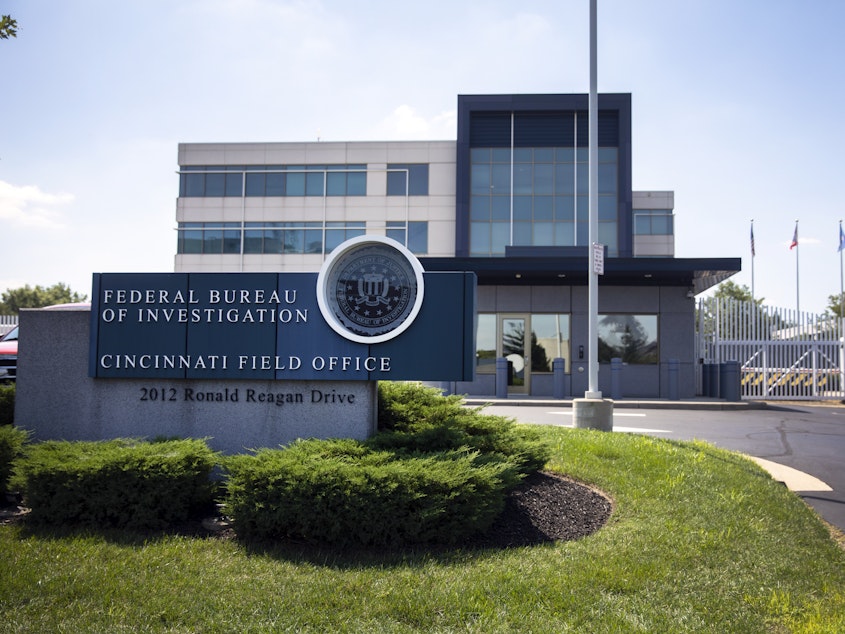 caption: The entrance to the FBI headquarters in Cincinnati is shown on Thursday. An armed man decked out in body armor tried to breach a security screening area at the field office, then fled and exchanged gunfire in a standoff with law enforcement, authorities said.