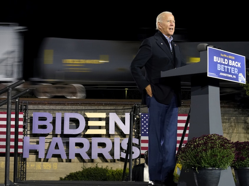 caption: Then-Democratic presidential candidate Joe Biden speaks at the Amtrak Johnstown Train Station, Sept. 30, 2020, in Johnstown, Pa.