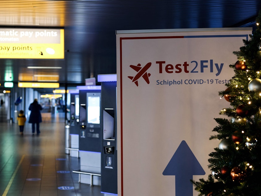 caption: Dutch health authorities say they've identified early cases of the new omicron variant of the coronavirus — including one from a sample taken the week before South Africa raised the alarm about the mutated variant. Other cases were found through tests at Schiphol airport in Amsterdam.