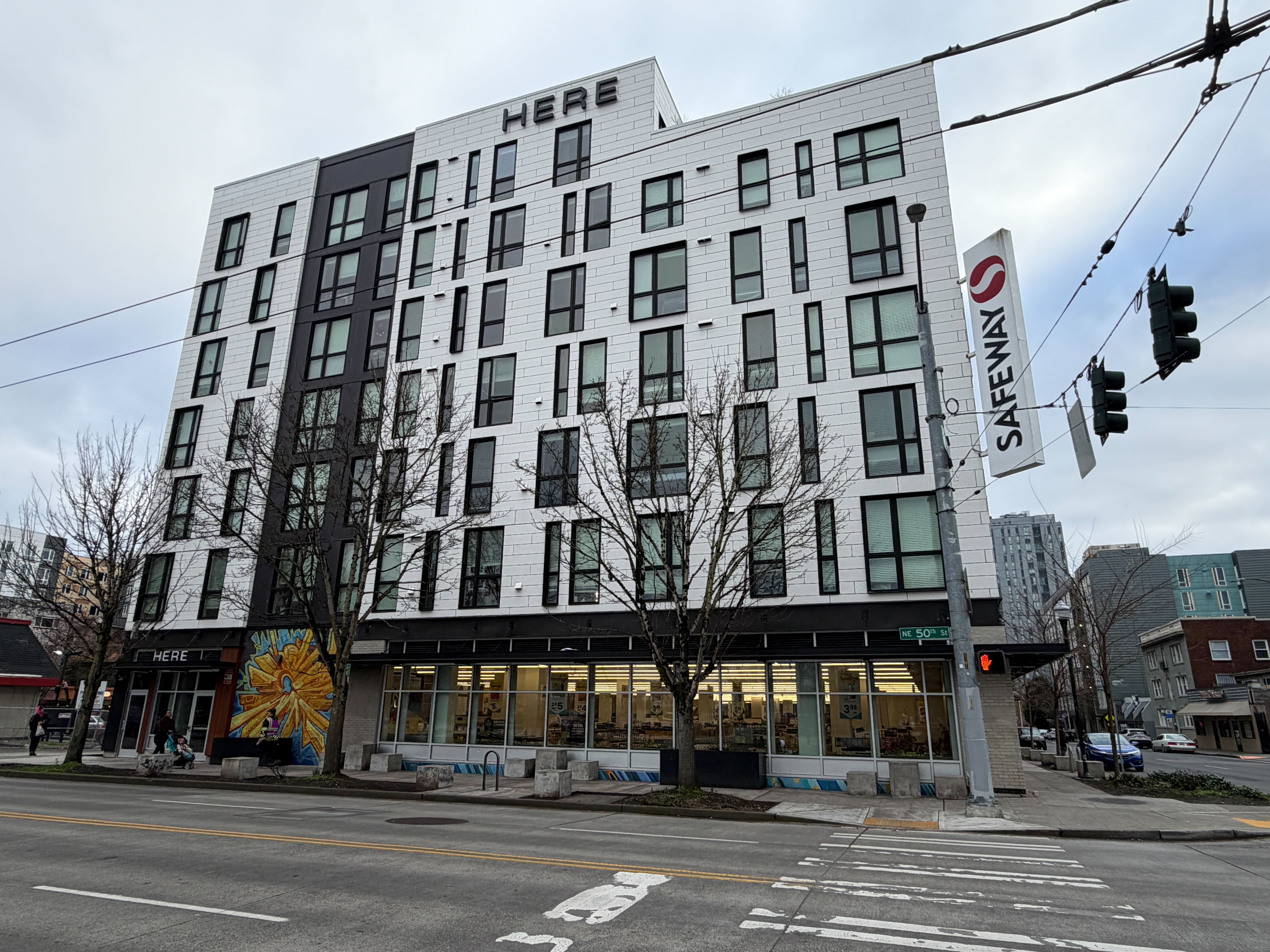 caption: A Safeway (50th Street and Brooklyn Avenue) takes the first floor of this apartment building in Seattle's University District, photographed Jan. 15, 2026. 
