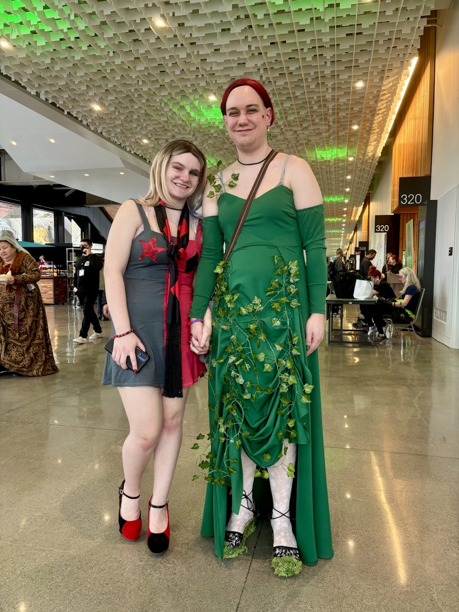 caption: Kasper Larson and Matthew Kendall are dressed as Harley Quinn and Poison Ivy, respectively, for Emerald City Comic Con on Feb. 29, 2024.