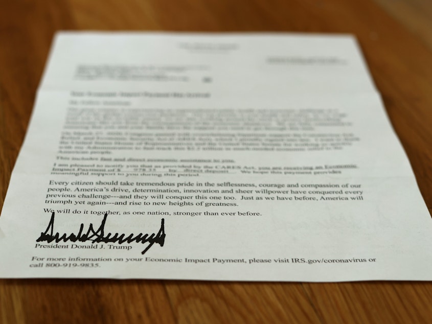 caption: A letter bearing the signature of President Trump was sent to people who received a coronavirus relief payment as part of the Cares Act. Some of those payments went to the bank accounts of dead people.