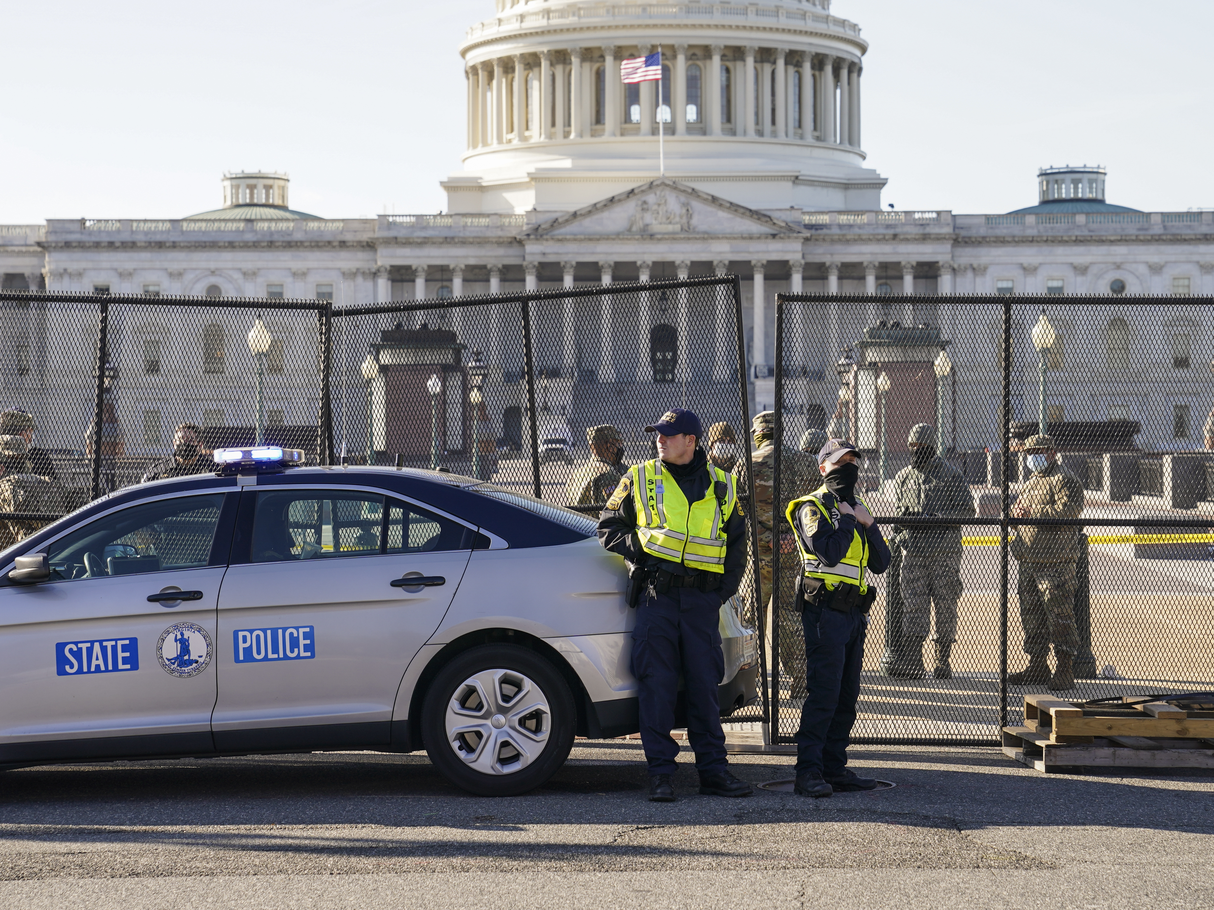 caption: Fencing is placed around the exterior of the Capitol grounds on Thursday, the day after pro-Trump rioters stormed the building. Lawmakers from both parties have criticized the U.S. Capitol Police's response to the security breach.