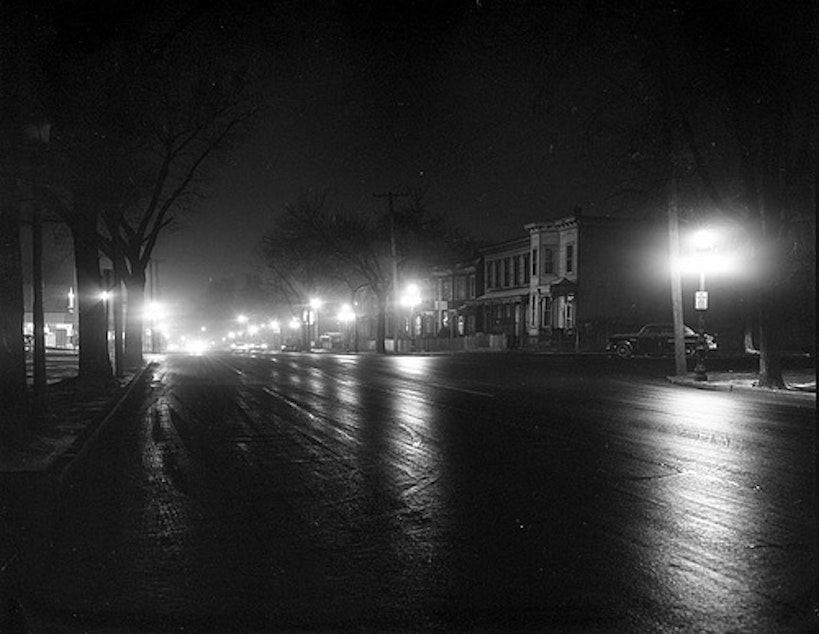 caption: Jefferson Avenue in Richmond, Va. at night -- in 1960. Even with streetlights, shadows loom. 