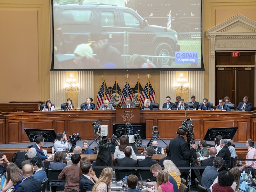 caption: A video of then-President Donald Trump's motorcade leaving the Jan. 6 rally on the Ellipse is displayed as Cassidy Hutchinson, a former top aide to then-White House Chief of Staff Mark Meadows, testifies about Trump's actions on that day.