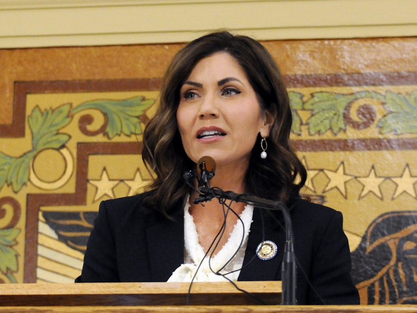 caption: South Dakota Gov. Kristi Noem, who has not issued a statewide stay-at-home order, is demanding that tribal leaders remove roadblocks they say have been put in place to protect reservation residents from the coronavirus pandemic.