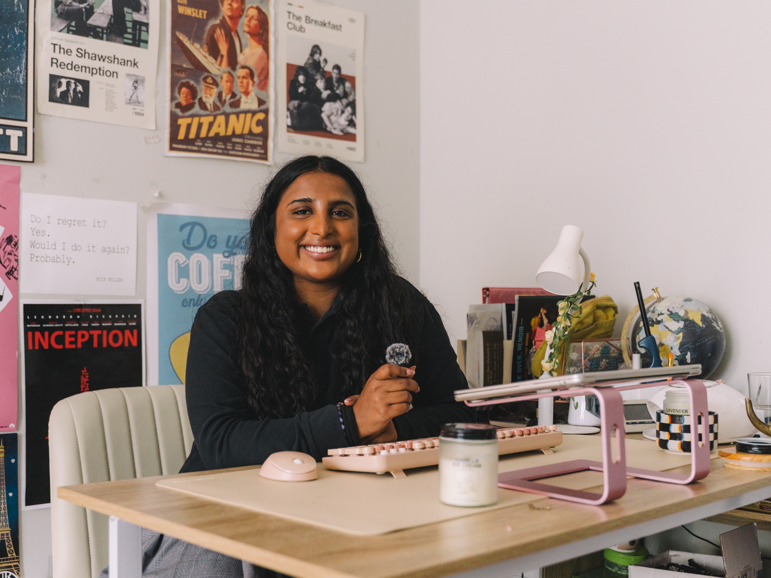 caption: Avani Yaltho, the 2025 high school winner of NPR's Student Podcast Challenge, poses for a portrait with her recording setup in her room in Houston.