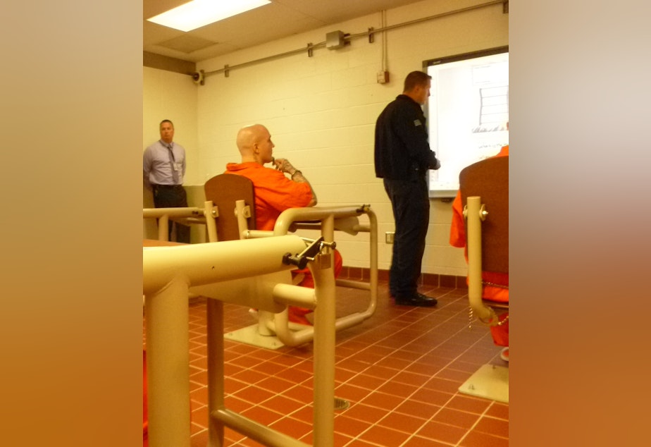 caption: Inmate Joshua Burgoyne, 31, watches Sgt. Mike Acree explain how negative self talk can be turned around. The program for offenders in long term isolation is an attempt to help lower infractions while in prison and when they're released. 