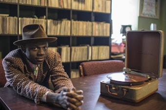 caption: "Having not grown up here, I feel I'm always educating myself on what this country is, what it has been and perhaps what it can be." J.S Ondara's debut album is <em>Tales of America.</em>