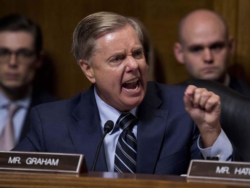 caption: Sen. Lindsey Graham, R-S.C., points at Democrats as he defends Supreme Court nominee Brett Kavanaugh at the Senate Judiciary Committee hearing last week.