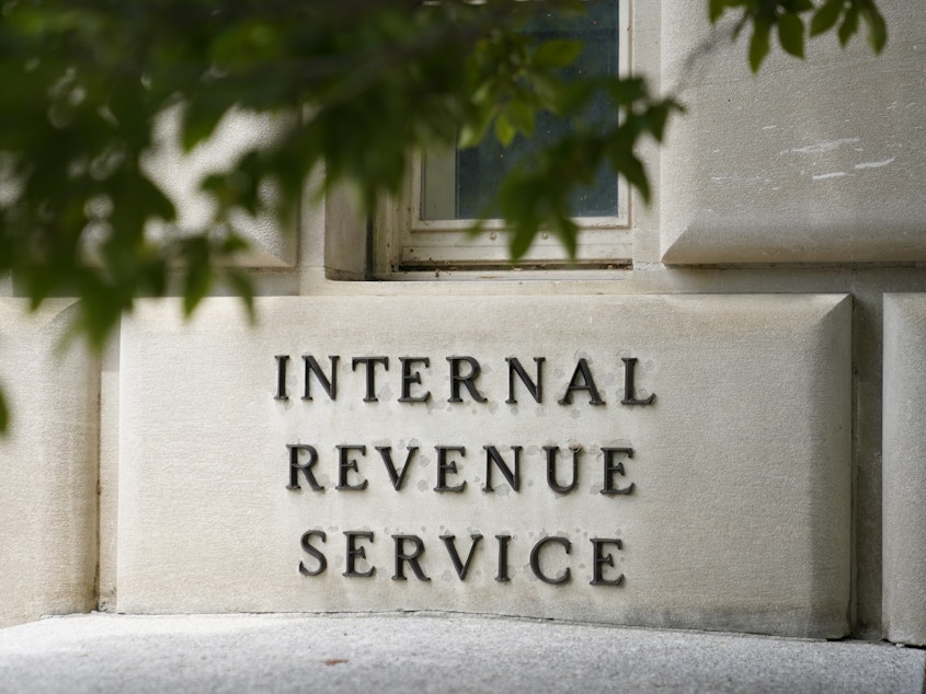 caption: A sign outside the Internal Revenue Service building in Washington, on May 4, 2021. Effective immediately, the Internal Revenue Service will end its decades-old policy of making unannounced home and business visits — in a nod to worker safety and combatting scammers who pose as IRS agents.