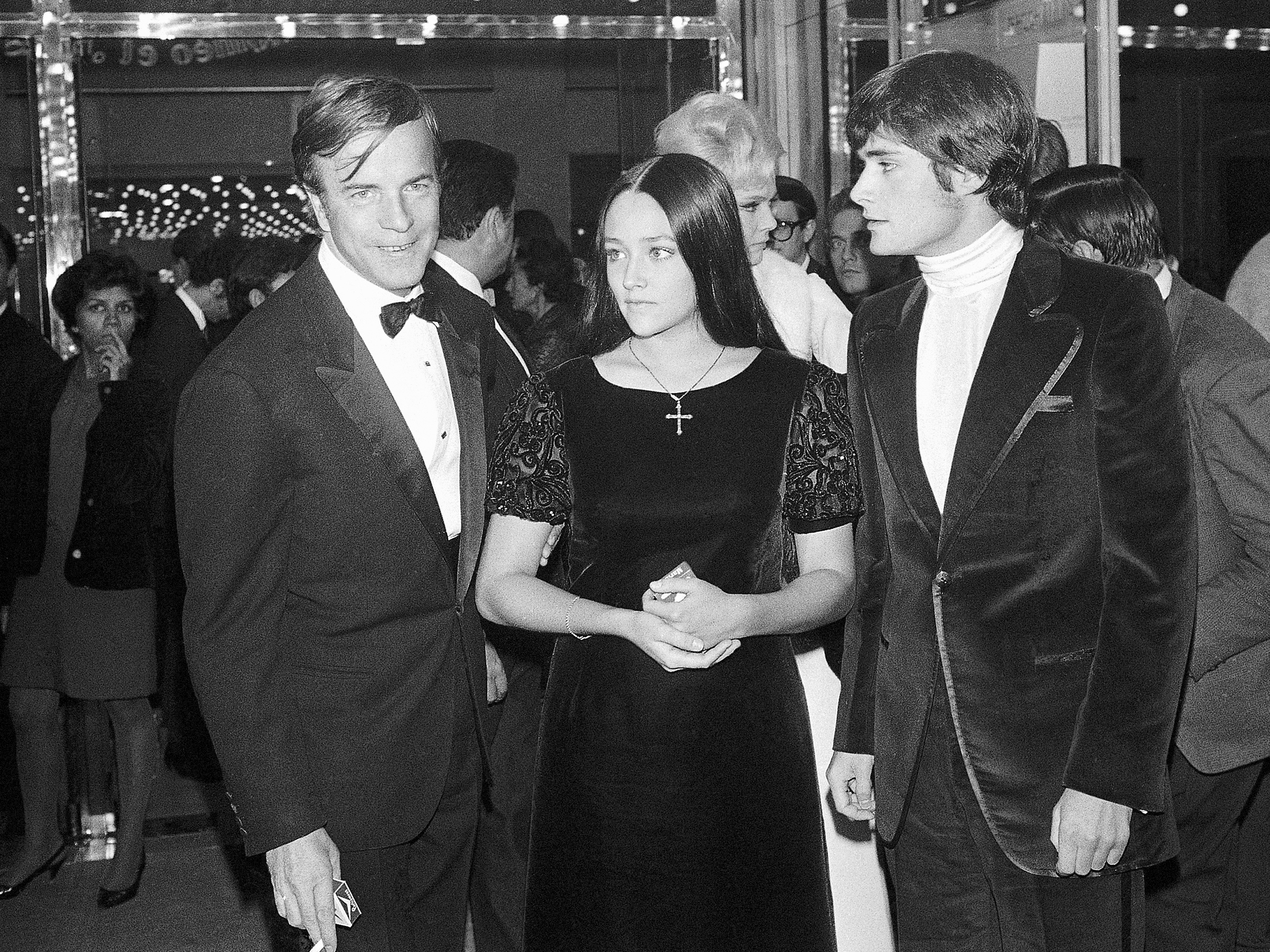 caption: "Romeo and Juliette" movie director Franco Zeffirelli (from left), actors Olivia Hussey and Leonard Whiting are seen after the Parisian premiere of the film in Paris on Sept. 25, 1968.