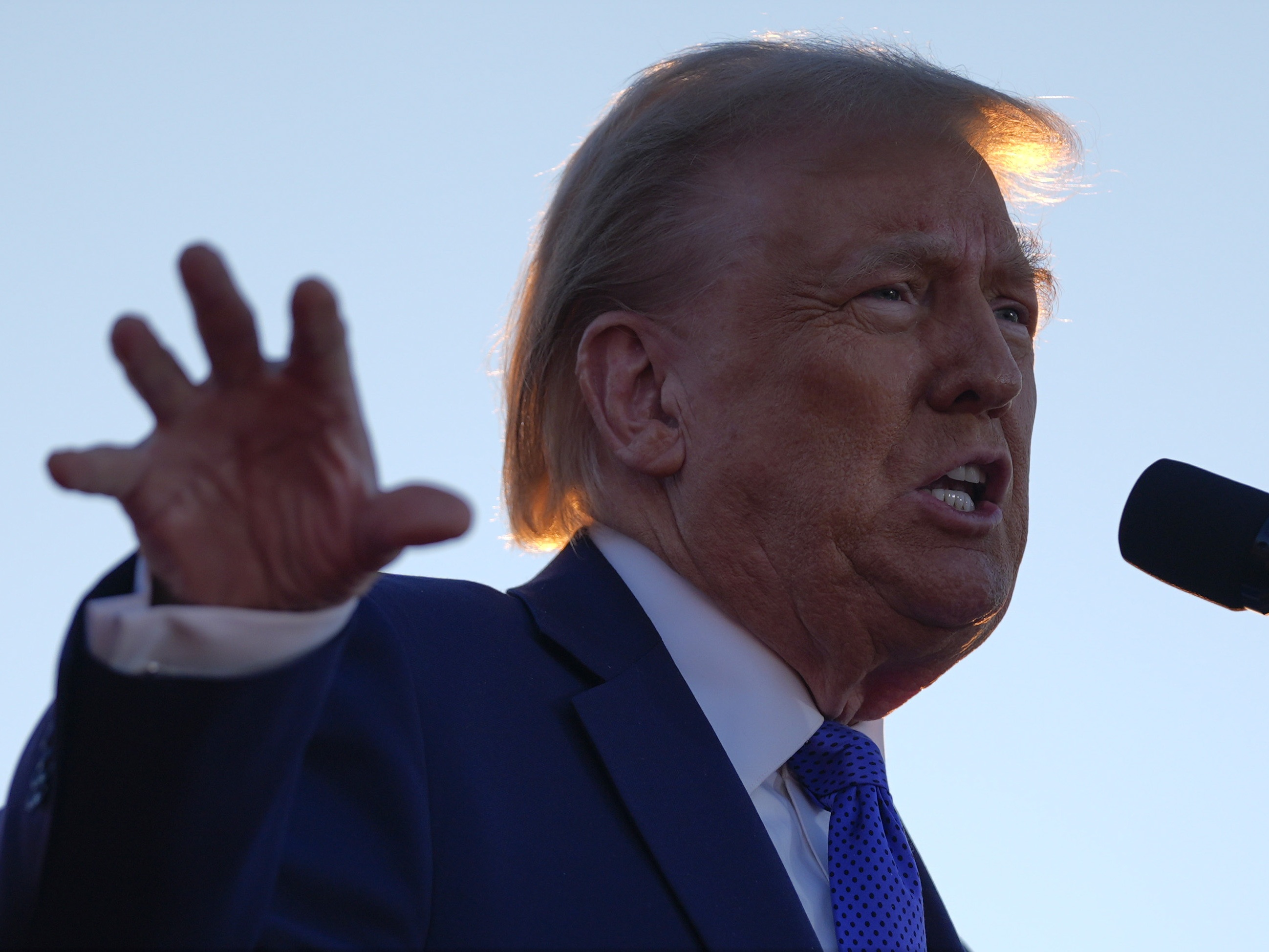 caption: Republican presidential nominee and former President Donald Trump speaks during a campaign rally at Arnold Palmer Regional Airport on Saturday in Latrobe, Pa.