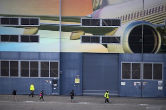 caption: Boeing employees are shown walking during shift change on Monday, December 16, 2019, in Renton. 